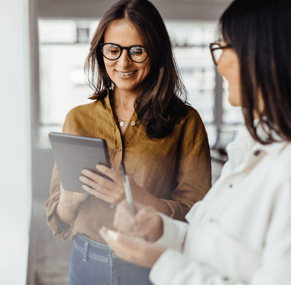 Women taking notes in a casual work office