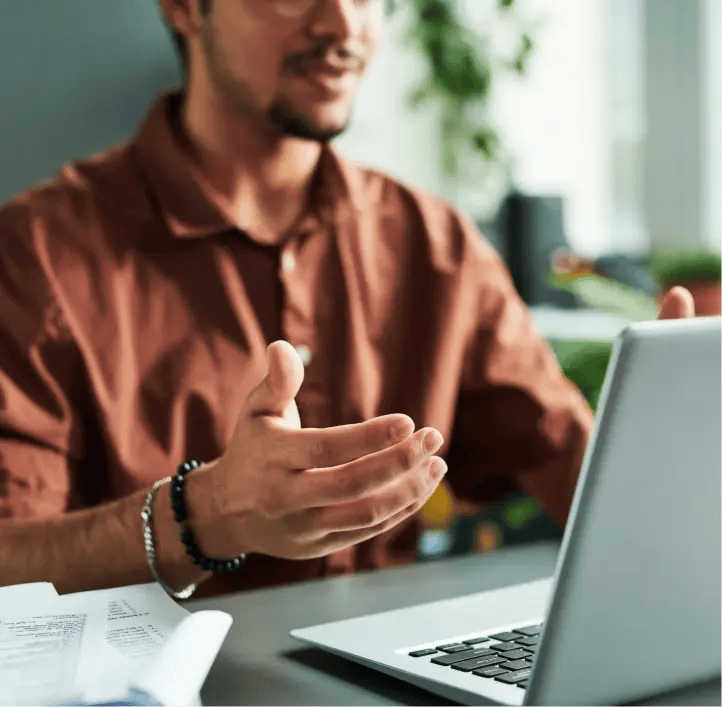 Man gesturing during video call